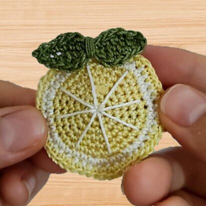 A crochet lemon hair clip