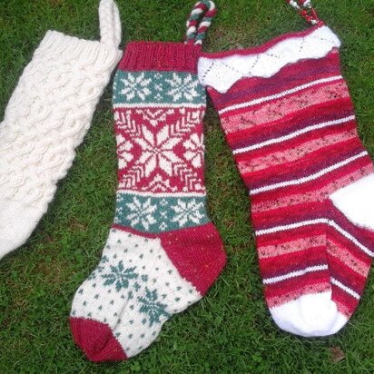 Three traditional knitted Christmas stockings