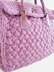 Textured bag knitted with woven pattern