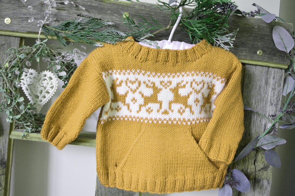 Christmas sweater with pocket and reindeers at WEBS