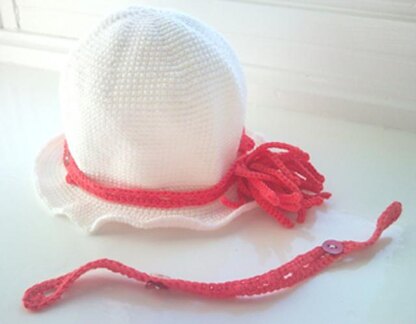 Crochet cloche hat with tassel flower