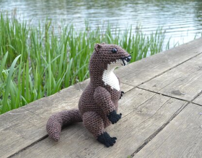 Crochet otter. Amigurumi toy. Realistic river otter. Crochet mammal