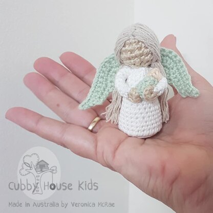 Miniature Angel holding baby