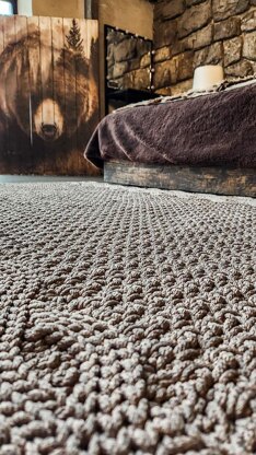 Wide rug with double braid