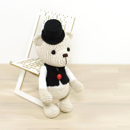 Teddy bear in a top hat and vest