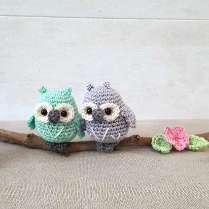 Owls couple on a branch