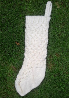 Three traditional knitted Christmas stockings