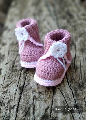 Baby bootie with split cuff and flower detail