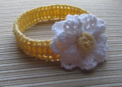 Yellow Knitted Headband with a White Flower