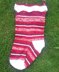 Three traditional knitted Christmas stockings
