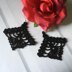 107. Black diamond-shaped earrings