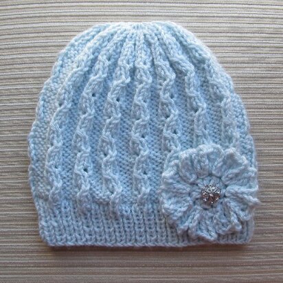 Blue Lacy Hat with a Crochet Flower for a Lady