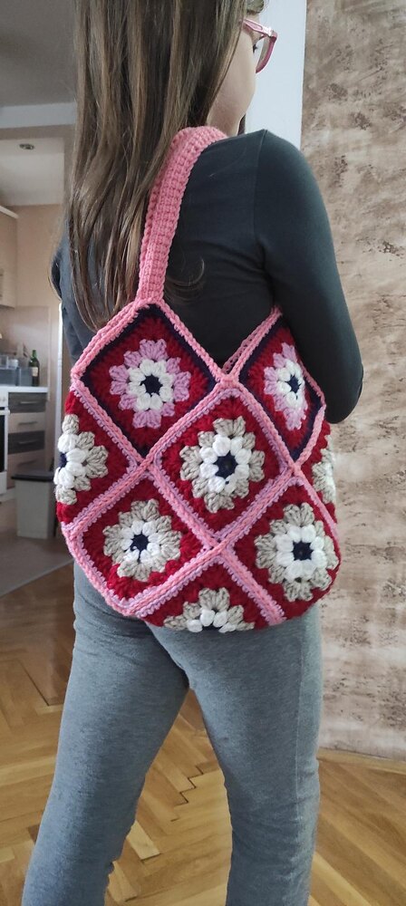My heart granny square bag is done! I made all the crochet pieces and my  stepmother sewed it together and put fabric and pockets in it as a gift  right before I