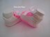 Pink and white baby shoes