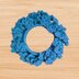 A crochet flower scrunchie