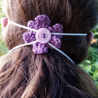 Crochet flower to hold facemask in place