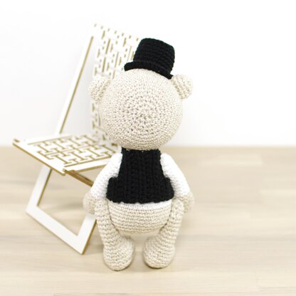 Teddy bear in a top hat and vest