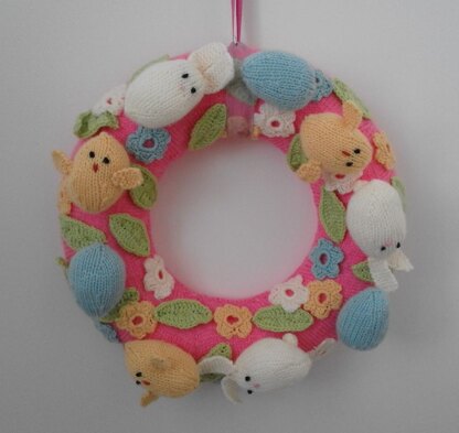 Knitted Easter wreath with chicks and bunnies