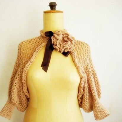 Knit lace shrug with knit flower pin