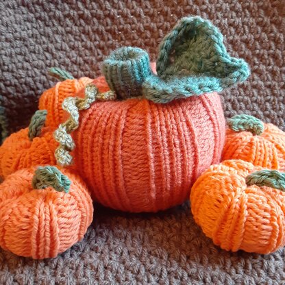 Loom knit pumpkins with crochet accents