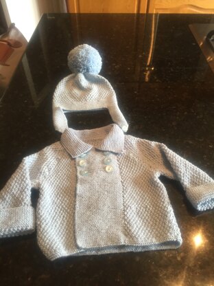 Baby boy’s coat and helmet