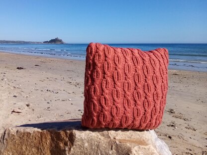 Two cabled aran cushion covers