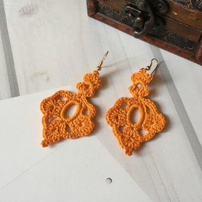 84. Orange oriental earrings