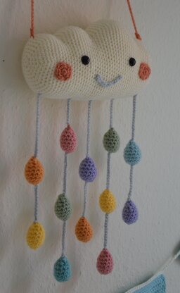 Cloud pillow and mobile with raindrops