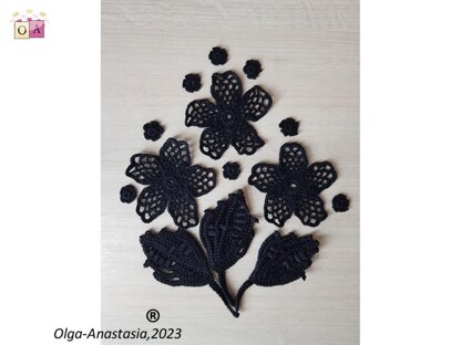 Crochet composition of flowers and leaves in black