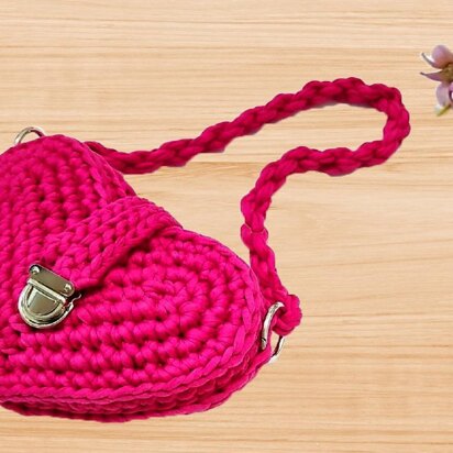 A crochet pink heart bag