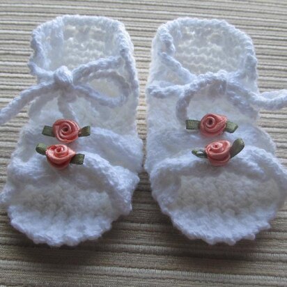 Knitted Sandals with Cables for a Baby Girl