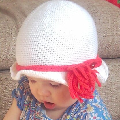 Crochet cloche hat with tassel flower