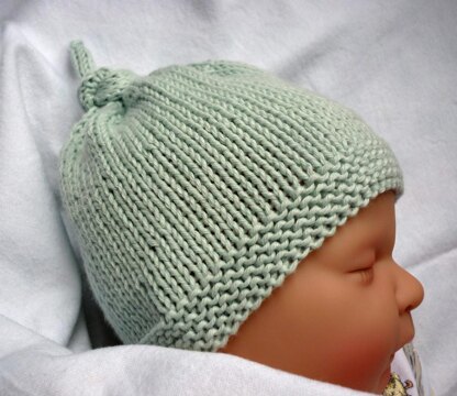 Tegan Baby Hat with Top Knot Knitting pattern by Julie Taylor | LoveCrafts