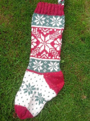 Three traditional knitted Christmas stockings