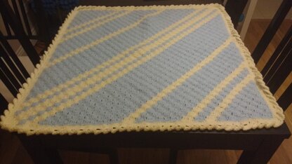 C2C baby blanket in blue with cream contrast stripes and wave edging