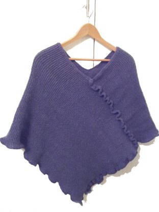 Knitted adult poncho with crochet trim