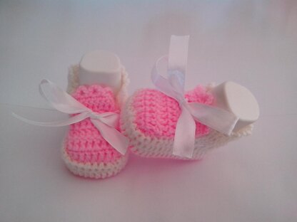 Pink and white baby shoes