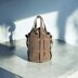 Bucket bag in baldric