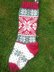 Three traditional knitted Christmas stockings