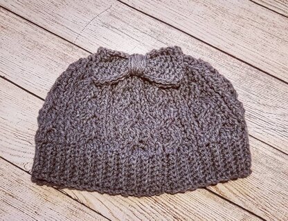 Cabled messy bun hat