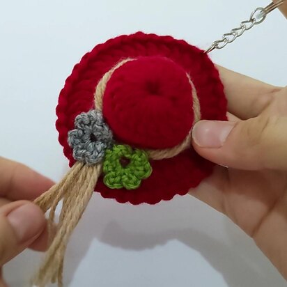 A crochet hat keychain