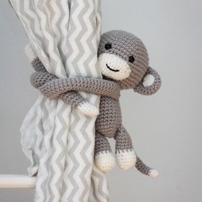 Monkey curtain tie back