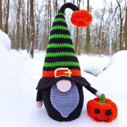 Halloween black gnome with pumpkin