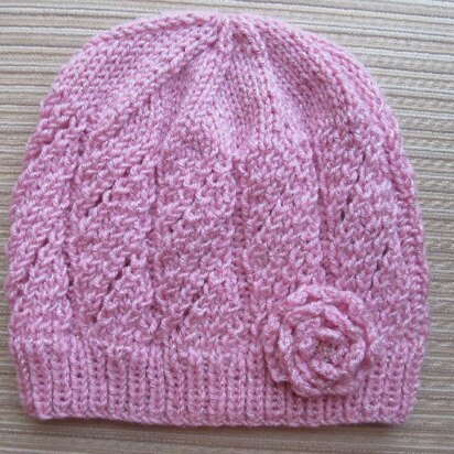 Pink Hat with Eyelet Panels and a Knit Rose for a Lady - knitting pattern