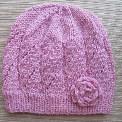 Pink Hat with Eyelet Panels and a Knit Rose for a Lady