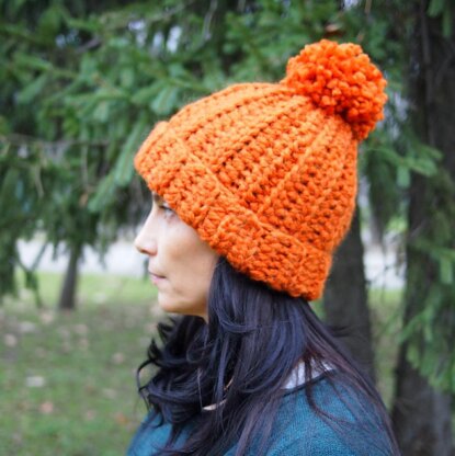 Knit look bulky hat with pom pom