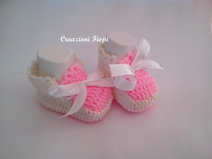 Pink and white baby shoes