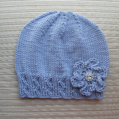 Lilac Hat with Zig Zag Ribbing and a Crochet Flower for a Lady