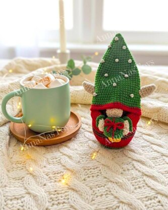 Сhristmas gnome Elf with a gift