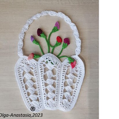 Crochet basket with a bouquet of flowers